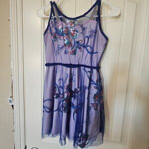 Blue mesh flower design over white dress